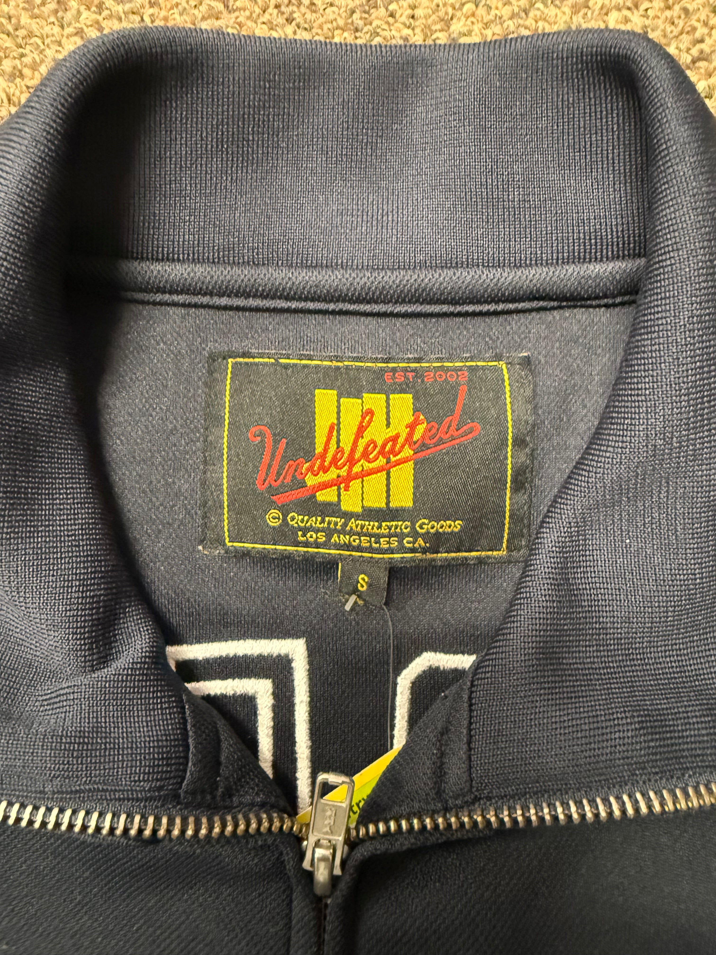 Undefeated Double Zipper Track Jacket